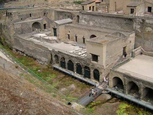 View of ancient buidlings to first floor with arches along bottom